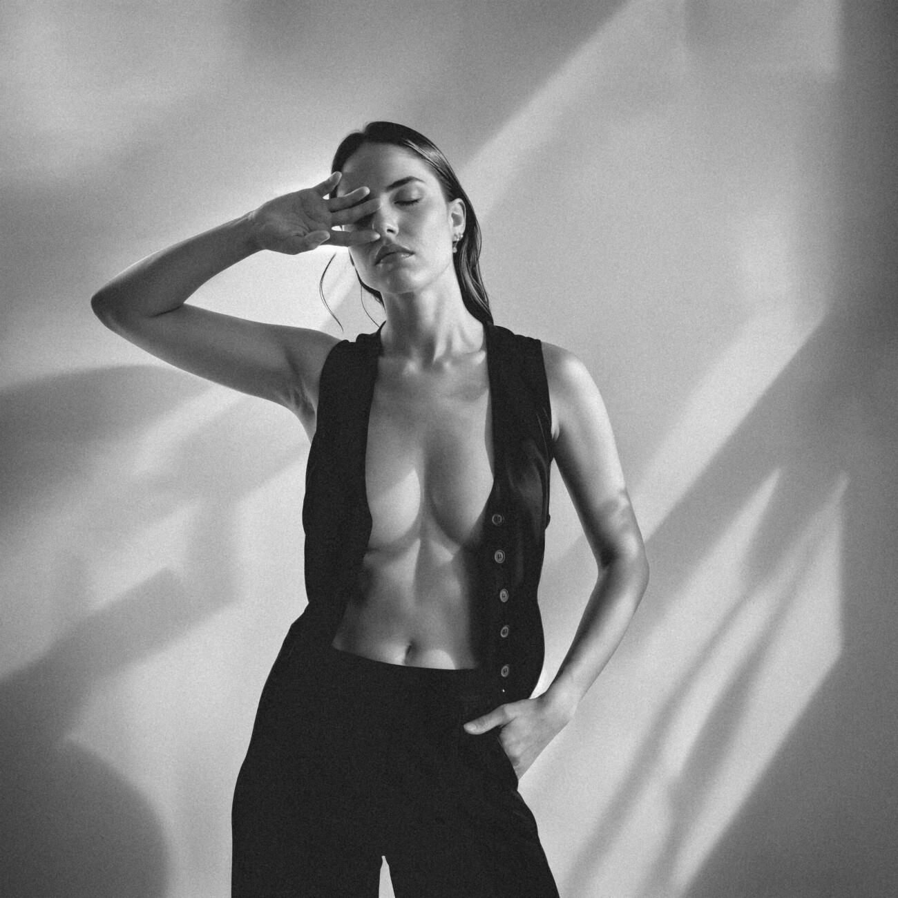 Black and white fashion photograph of model Rébecca Bagnol from the 'Rebecca Bagnol – Shadows' series by photographer Étienne Delorme – image 06